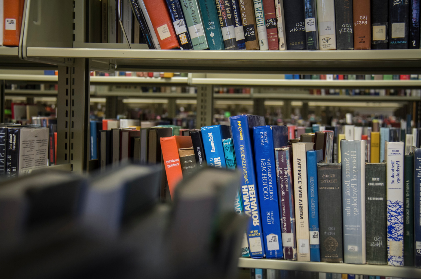 Books on a shelf inside a library